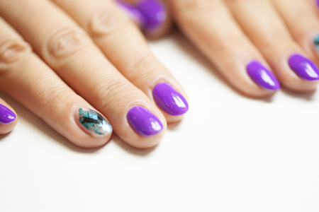 Female hands in manicure salon with a beautiful manicureの写真素材