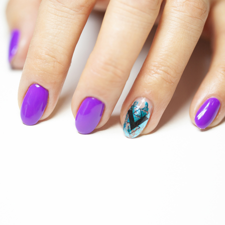 Female hands in manicure salon with a beautiful manicureの写真素材
