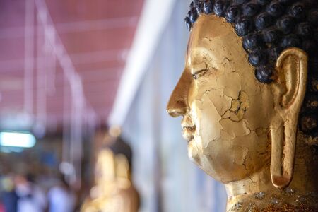A statue of Buddha in the temple of Thailandの写真素材