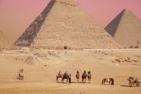 Cairo, Giza plato Egypt - Feb 08 2019: General view of pyramids with a touristsのeditorial素材