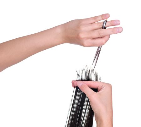 hairdresser is cutting young woman