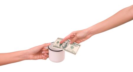 woman gives alms to another woman の写真素材