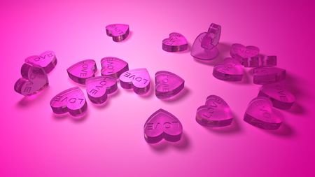 pink pills in heart shape for making loveの写真素材