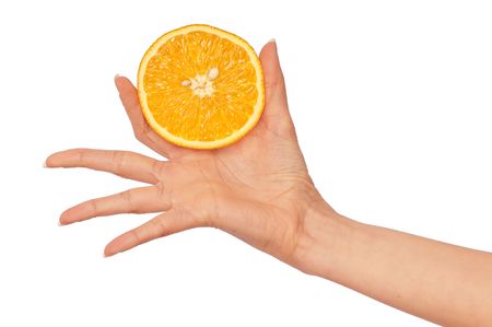orange in the woman's hand for keping the dietの写真素材