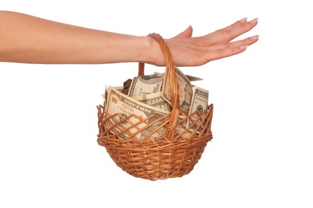 woman holding a basket with money for buying some goodsの写真素材