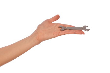 woman holding chrome vanadium spanner in the handの写真素材