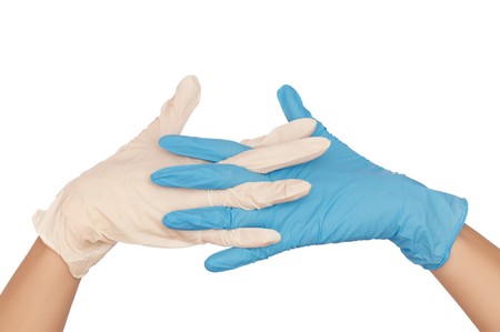 doctor put blue and white sterilized medical glove for making operationの写真素材