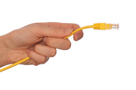 woman holding LAN cord in the handの写真素材