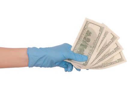 doctor take of fake dollars in the handの写真素材