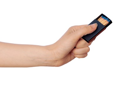 Box of matches in the womans hand for bonfire in the office for secret documentsの写真素材