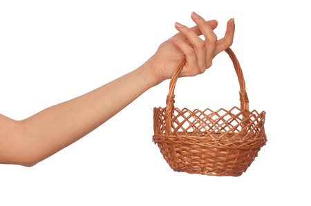 one brown empty basket for fruit on woman's handの写真素材