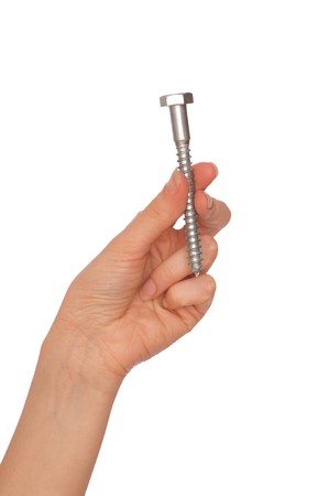 woman holding big bolt in the handの写真素材