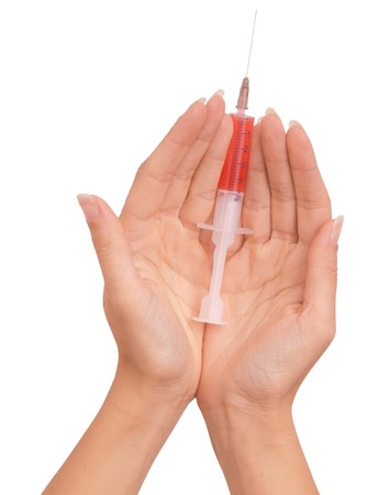 Woman use syringe with a new synthetic hard drugs mixed with blood for escape from realityの写真素材