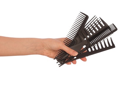 hairdresser holds the black tools for haircutの写真素材