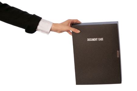 The office worker holds the document case in the handsの写真素材