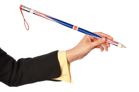 businesswoman drawing diagrams for her partners on the meeting with big funny pencil