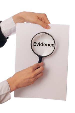 Investigator examines in details the materials of evidence reported by advocateの写真素材