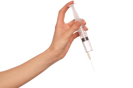 syringe in the woman's hand for making injectionsの写真素材