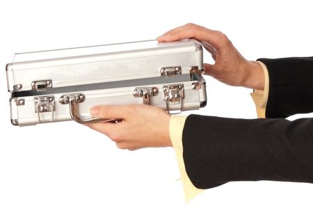 woman unlocking metal grey case with moneyの写真素材