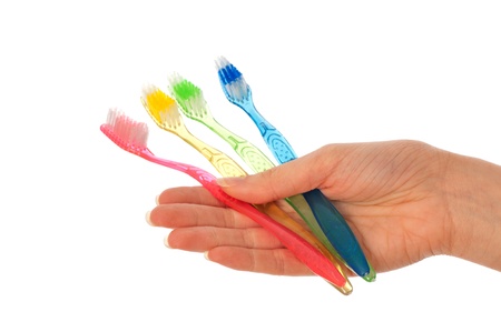 red brush for toothpaste in the doctor's hand