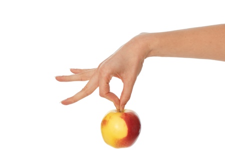 woman holding in the hand one fresh yellow with red-edged Appleの写真素材