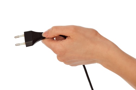 woman holding black euro plug in the hand