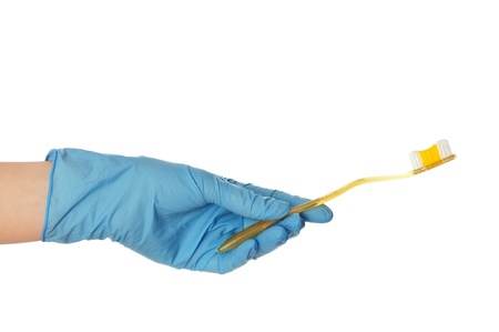 yellow brush for toothpaste in the doctor's handの写真素材