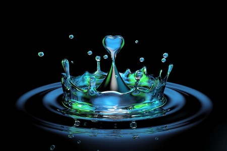 falling heart shaped water drop into the red waterの写真素材