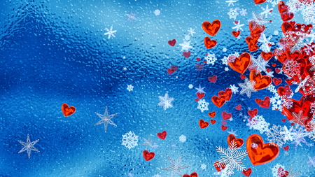 Set of hearts and snowflakes with a blue ice backdrop as a symbol of romantic love for the congratulations on Valentine's Day in february and winter weddings. Abstract horizontal background.の写真素材
