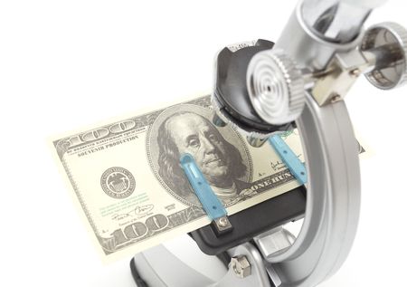 Microscope examining dollar strength