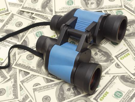 Discovers the wealth,Binoculars and moneyの写真素材