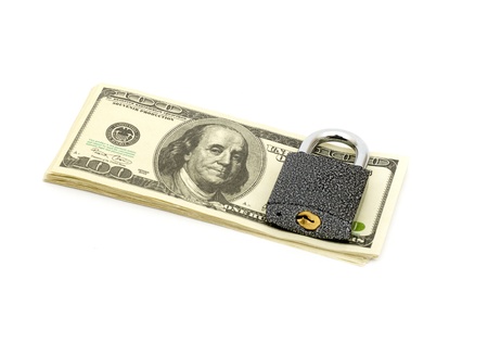 lock and stack money isolated on whiteの写真素材