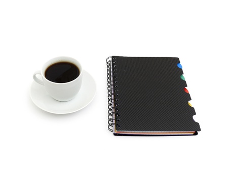 Worktable covered with documents and cup coffee