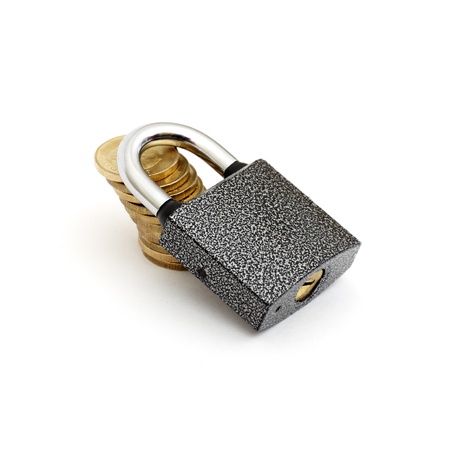 locked money concept. stack coin and lock isolated on whiteの写真素材