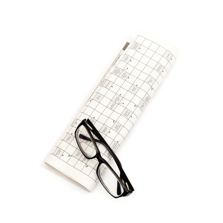 Glasses, pen over mutual funds data on newspaperの写真素材