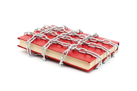 Censorship concept with books and chains on whiteの写真素材