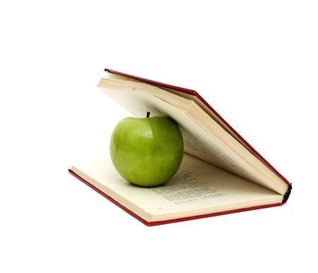 Book and green appleの写真素材