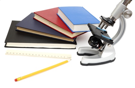 Microscope, books isolated on a white backgroundの写真素材
