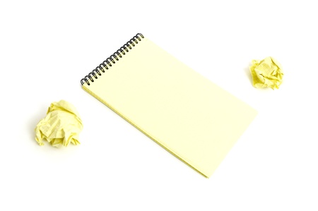 Notebook and crumpled paper isolated on white backgroundの写真素材