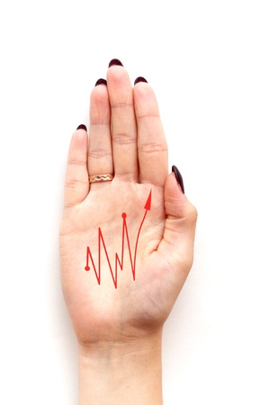 red diagram on woman hand isolated on white backgroundの写真素材