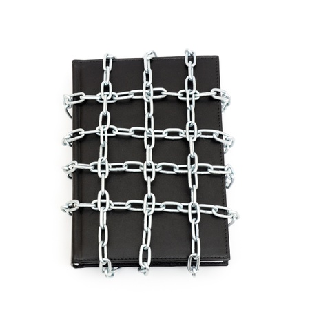 Censorship concept with book and chains on whiteの写真素材