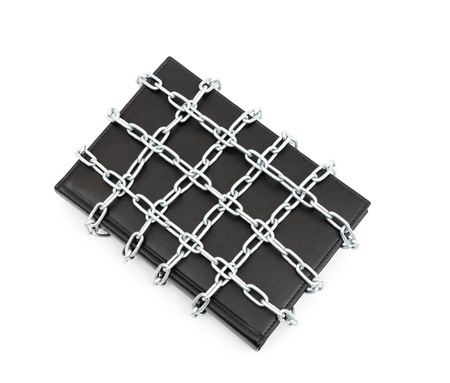 Censorship concept with book and chains on whiteの写真素材