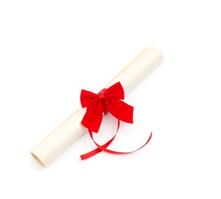 Diploma with red ribbon on white backgroundの写真素材