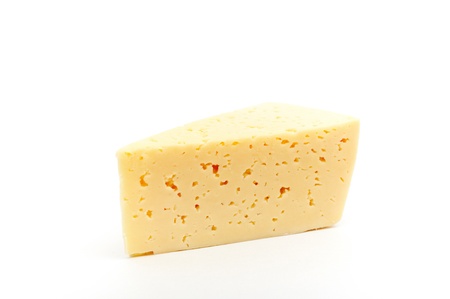 yellow cheese  isolated on a white backgroundの写真素材