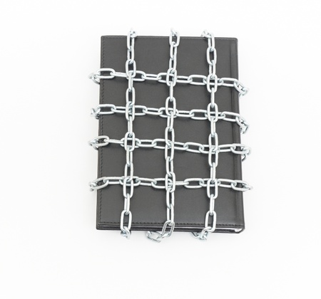 Censorship concept with book and chains on whiteの写真素材
