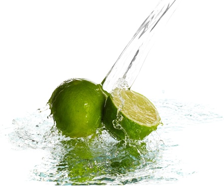 Water splash on lime isolated on whiteの写真素材
