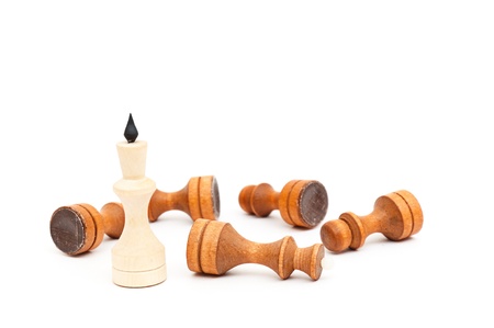 King in the foreground against a background of black army chips.の写真素材