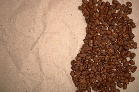 coffee beans on a old paper backgroundの写真素材