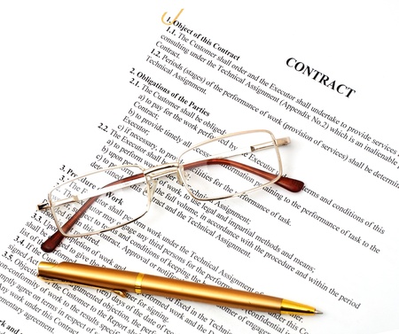 legal contract papers with pen and glassesの写真素材