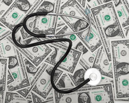 Stethoscope and dollars illustrating expensive healthcareの写真素材